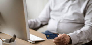 senior man doing online shopping with a credit car 2021 08 26 22 40 00 utc