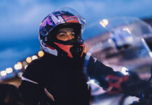 woman on motorbike in the city at night 2022 12 16 11 04 09 utc