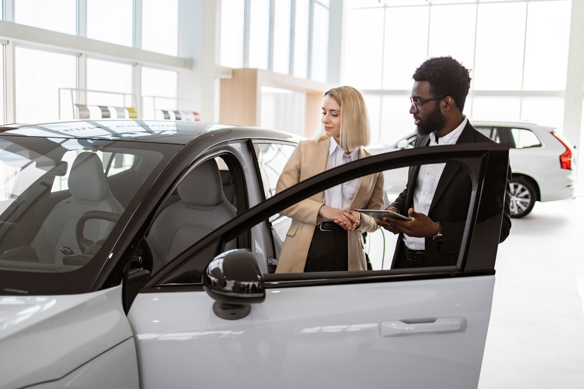 african male car dealer standing with client of de 2024 04 17 17 17 00 utc