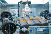 Bangkok, Thailand February 21, 2025: High tech automotive manufacturing display featuring robotic arms assembling lithium Ion EV battery pack and demonstrating Hyundai electric vehicle platform